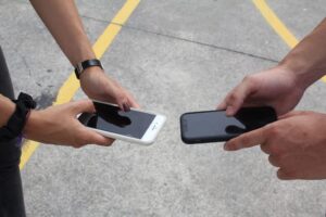 comparing two smartphones hands